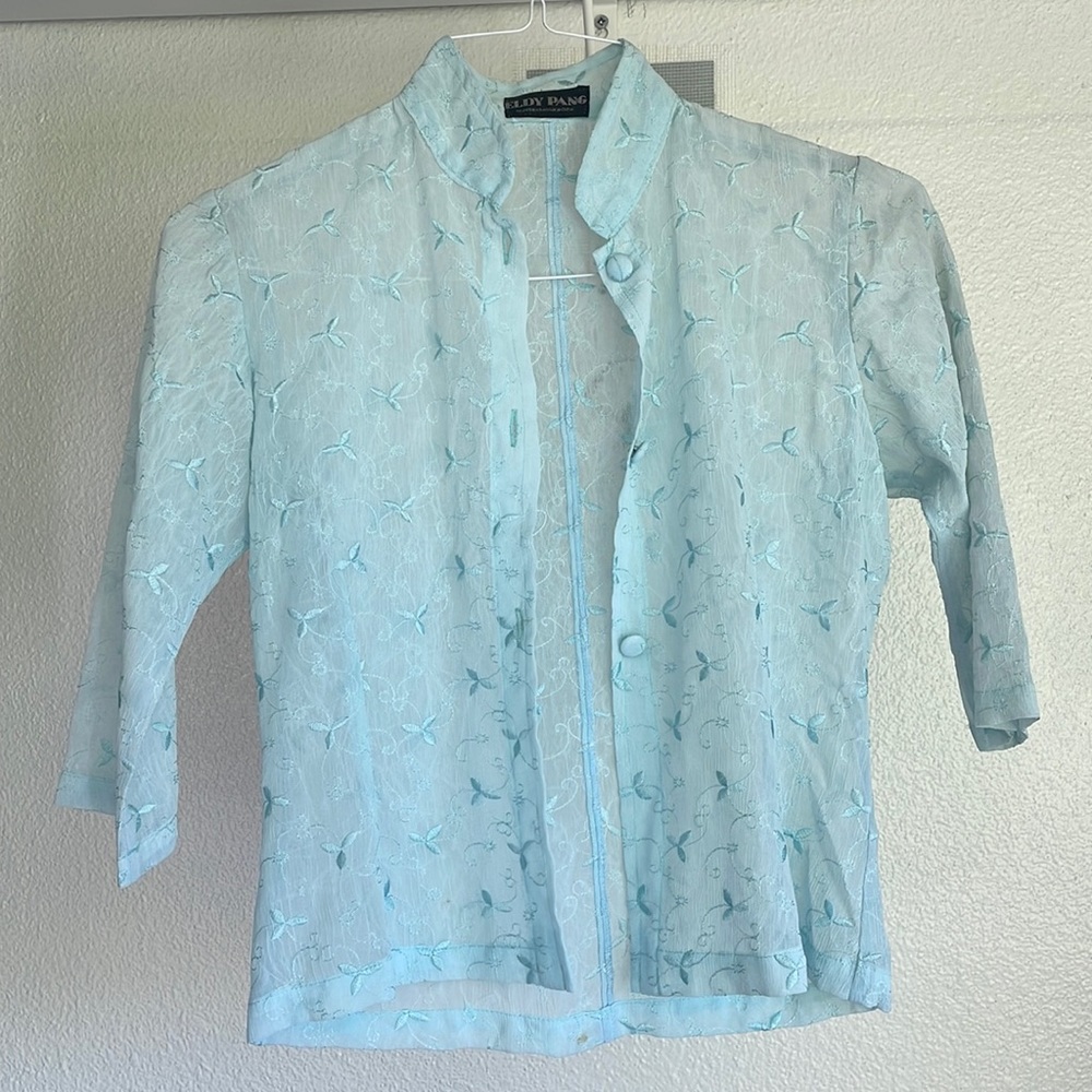 Light blue button down top with 3/4 sleeve